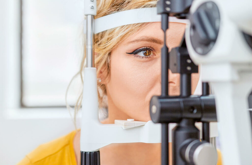 A woman in her forties getting her eyes checked by her optometrist for early signs of glaucoma.