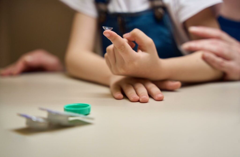 Close-up of a child handling MiSight contact lenses showcasing proper use and benefits for managing myopia effectively